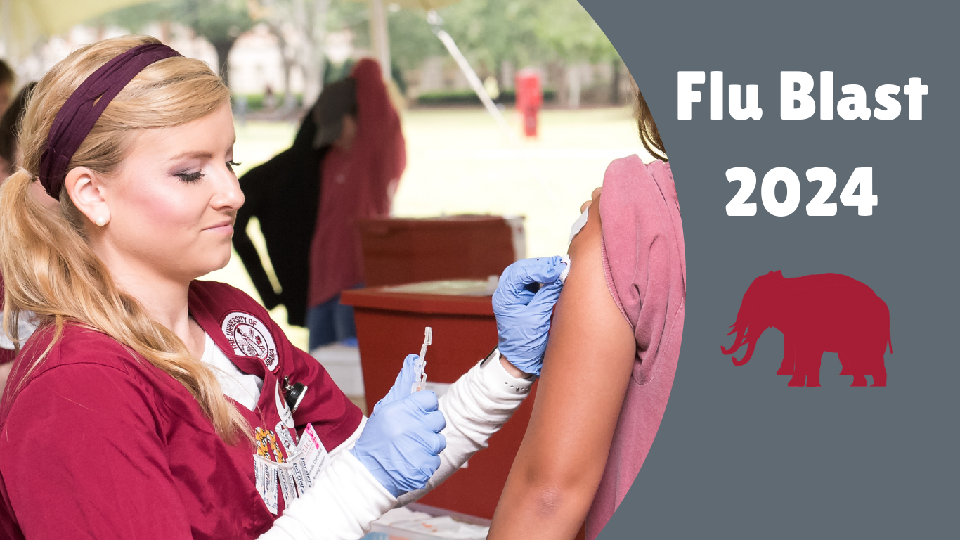Blonde haired female nursing student giving a UA student a flu shot in the left arm