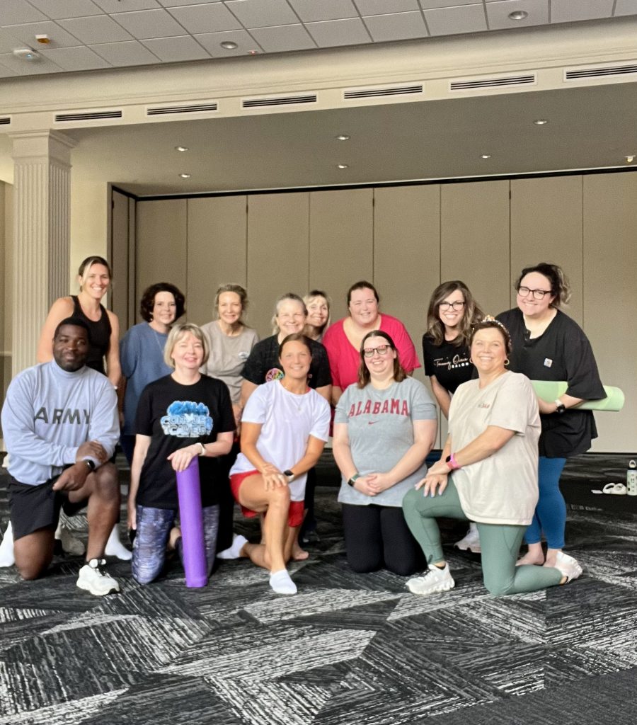 group posing after yoga class