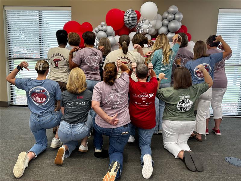 Display of people wearing vintage WellBAMA t-shirts