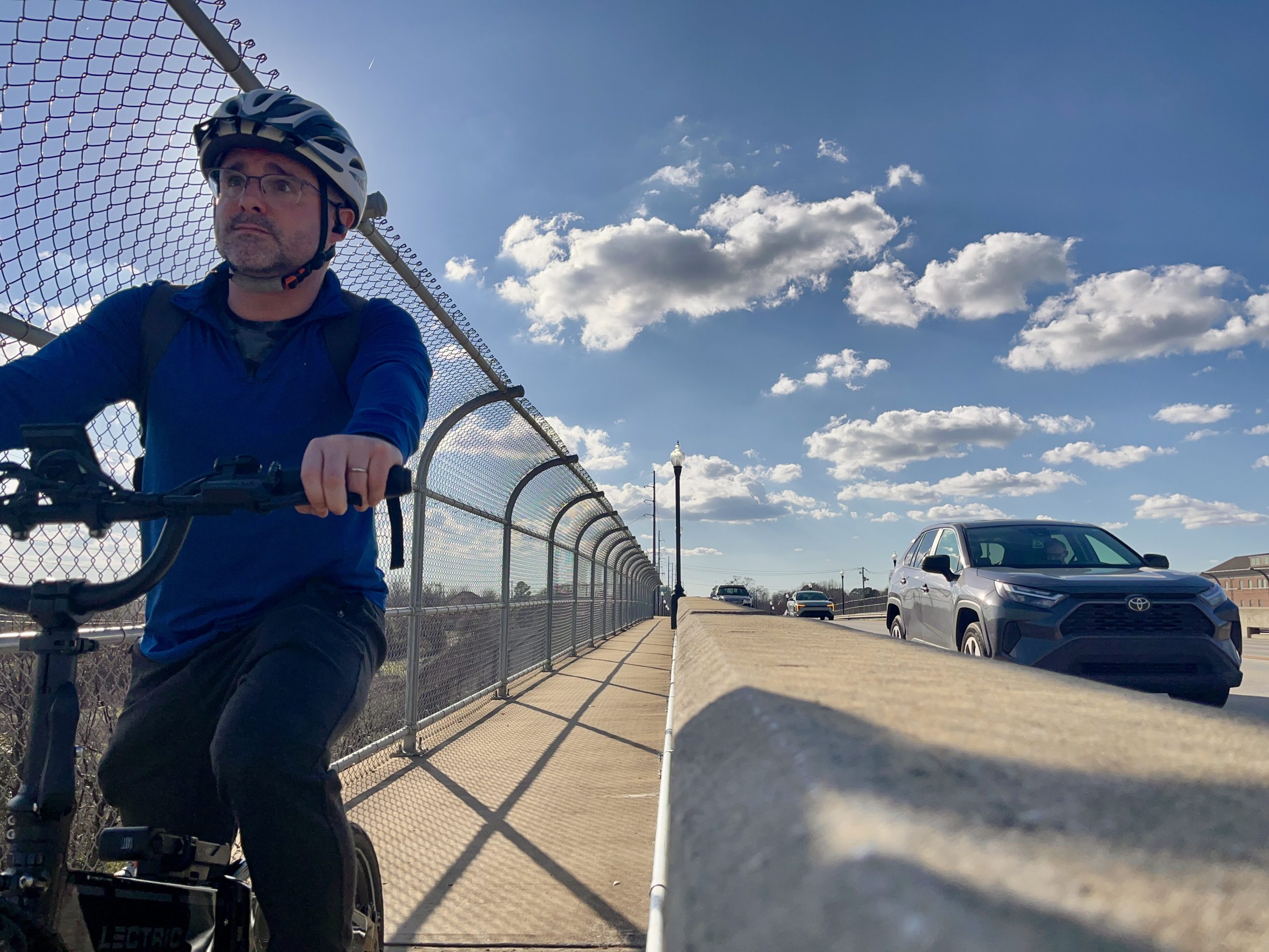 Xabier cycling on bridge in Tuscaloosa